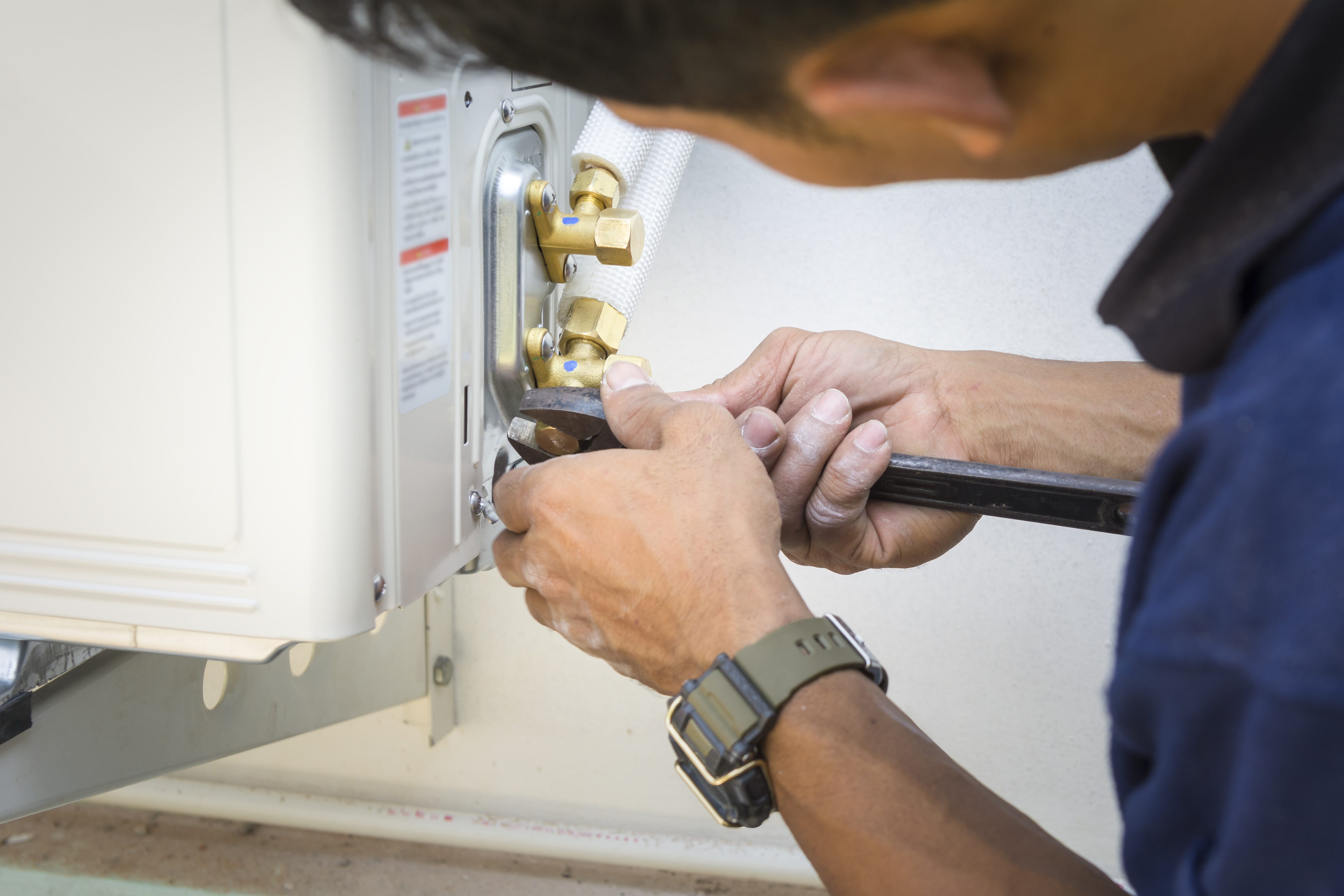 Man Installing Air Conditioner